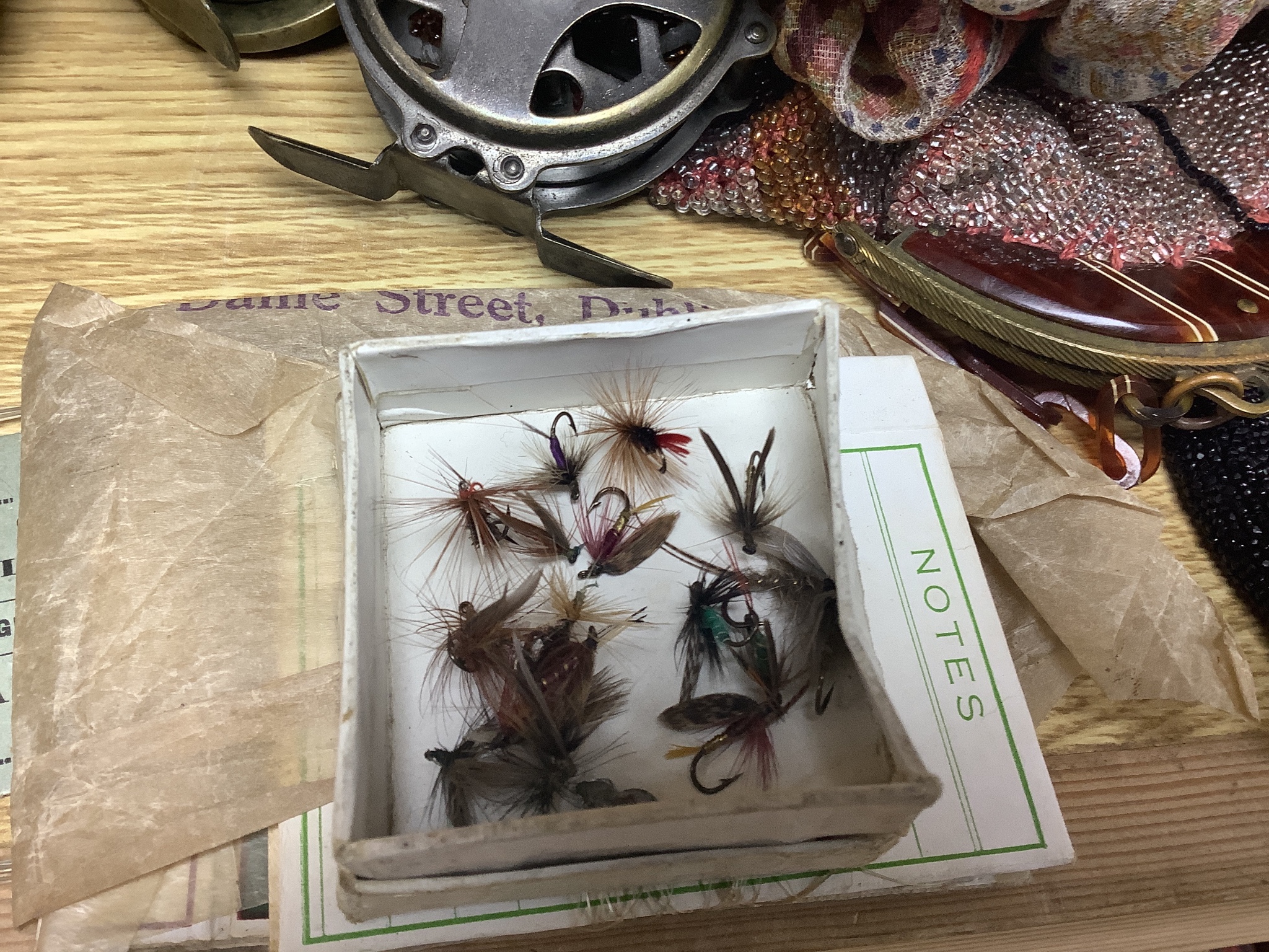 Three fishing reels, flies, lines etc., and a collection of Noddy and Mickey Mouse toys